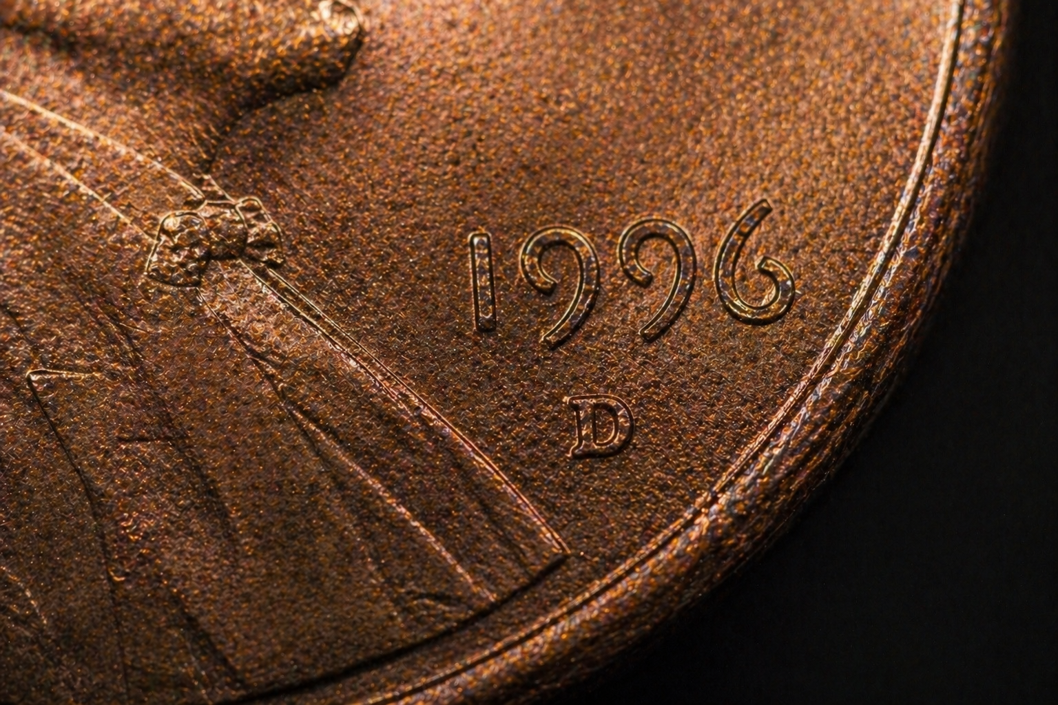 Close up of penny edge and surface showing wear pattern