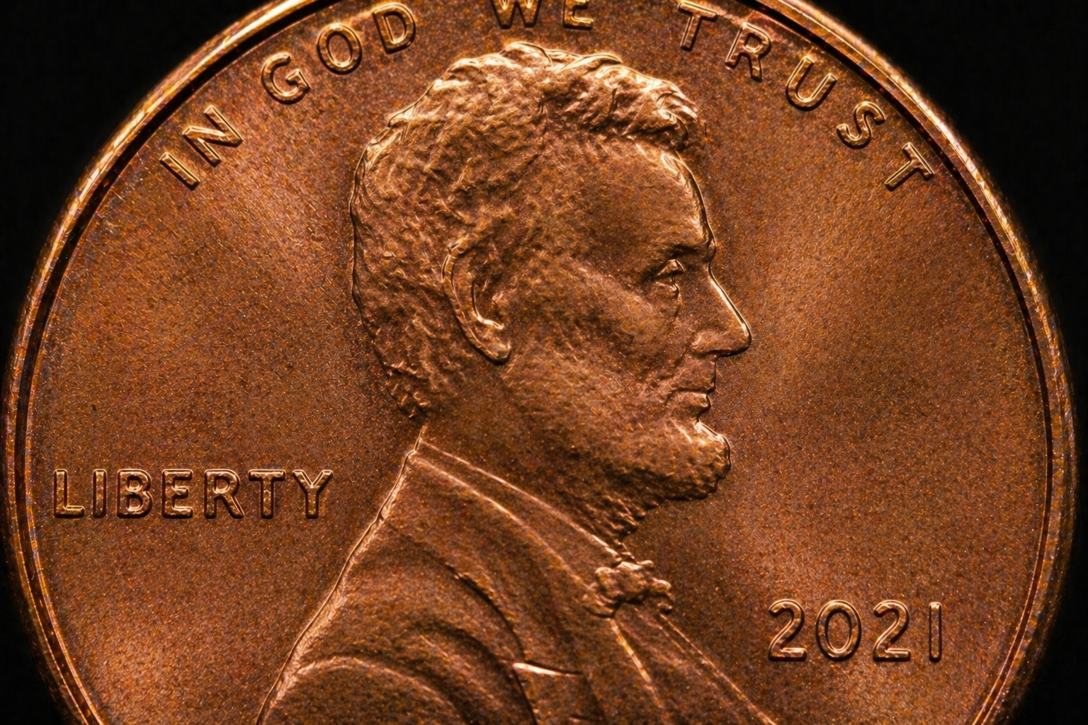 Close up of penny front showing portrait and lettering