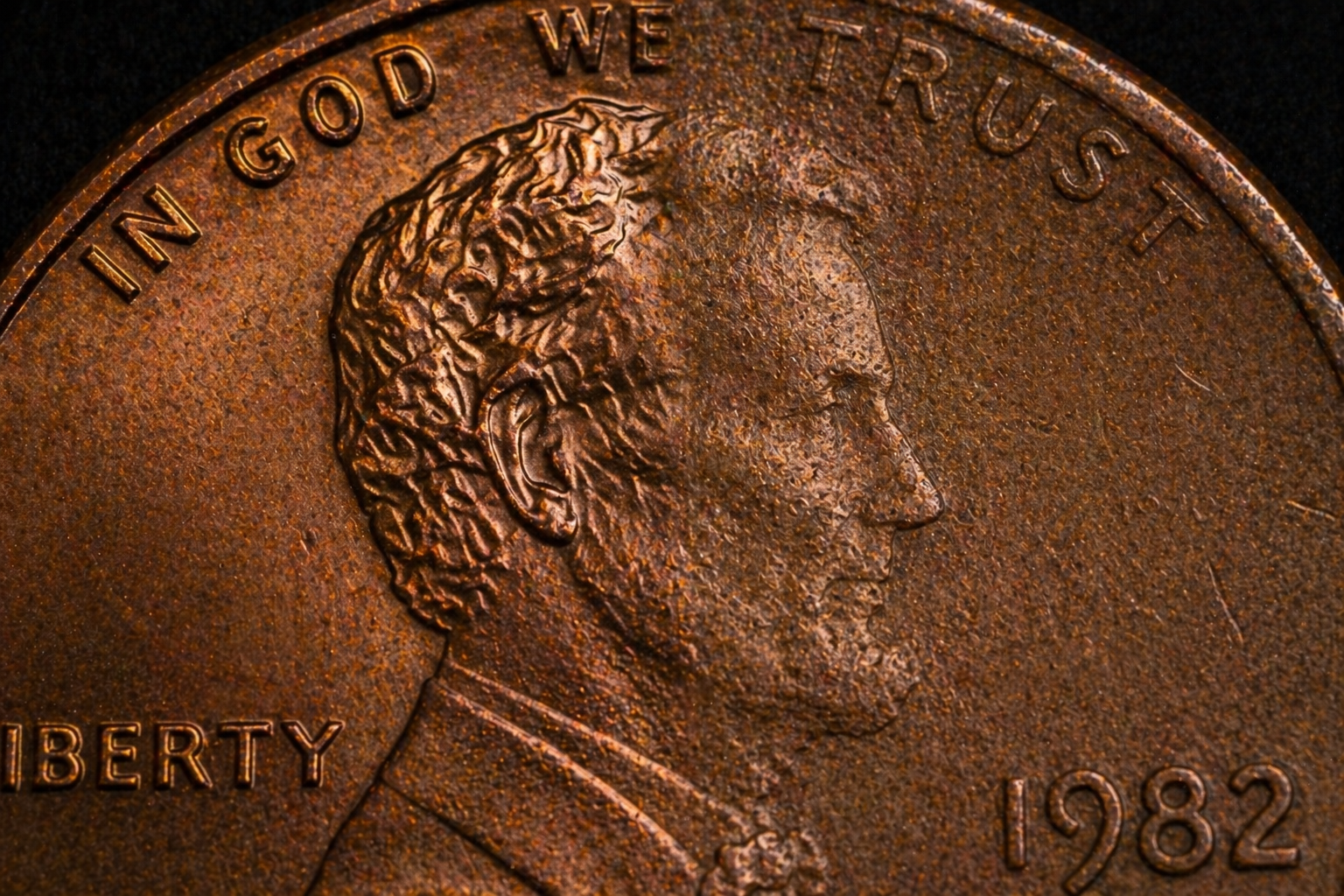Close up of penny showing faded and sharp engraving comparison
