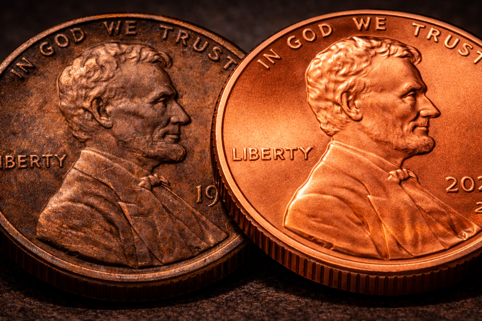 Comparison of old and newer pennies showing color difference