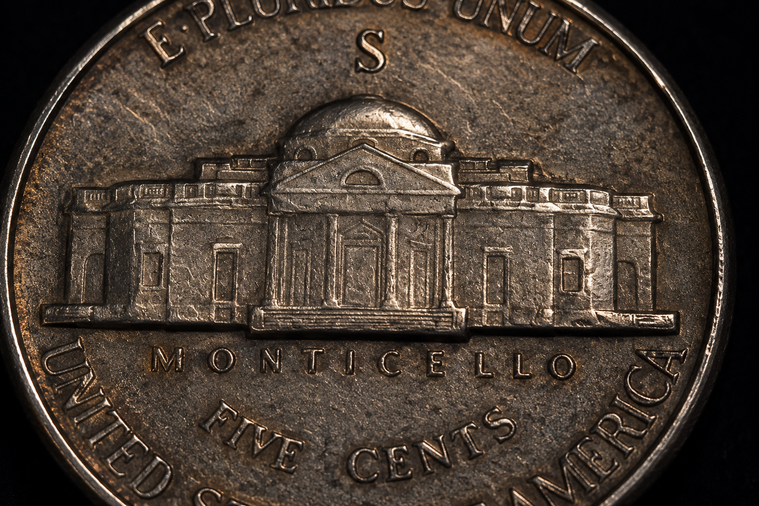 Close-up of a coin showing the highest design points used to evaluate wear and preservation