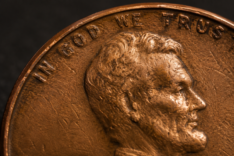 Close up of penny surface showing tiny scratches and wear patterns